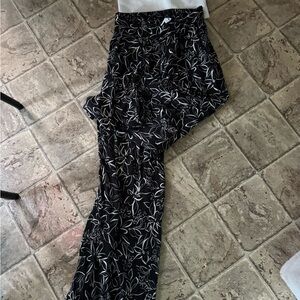 Kirious White Knit sweater tube top with floral bottoms.